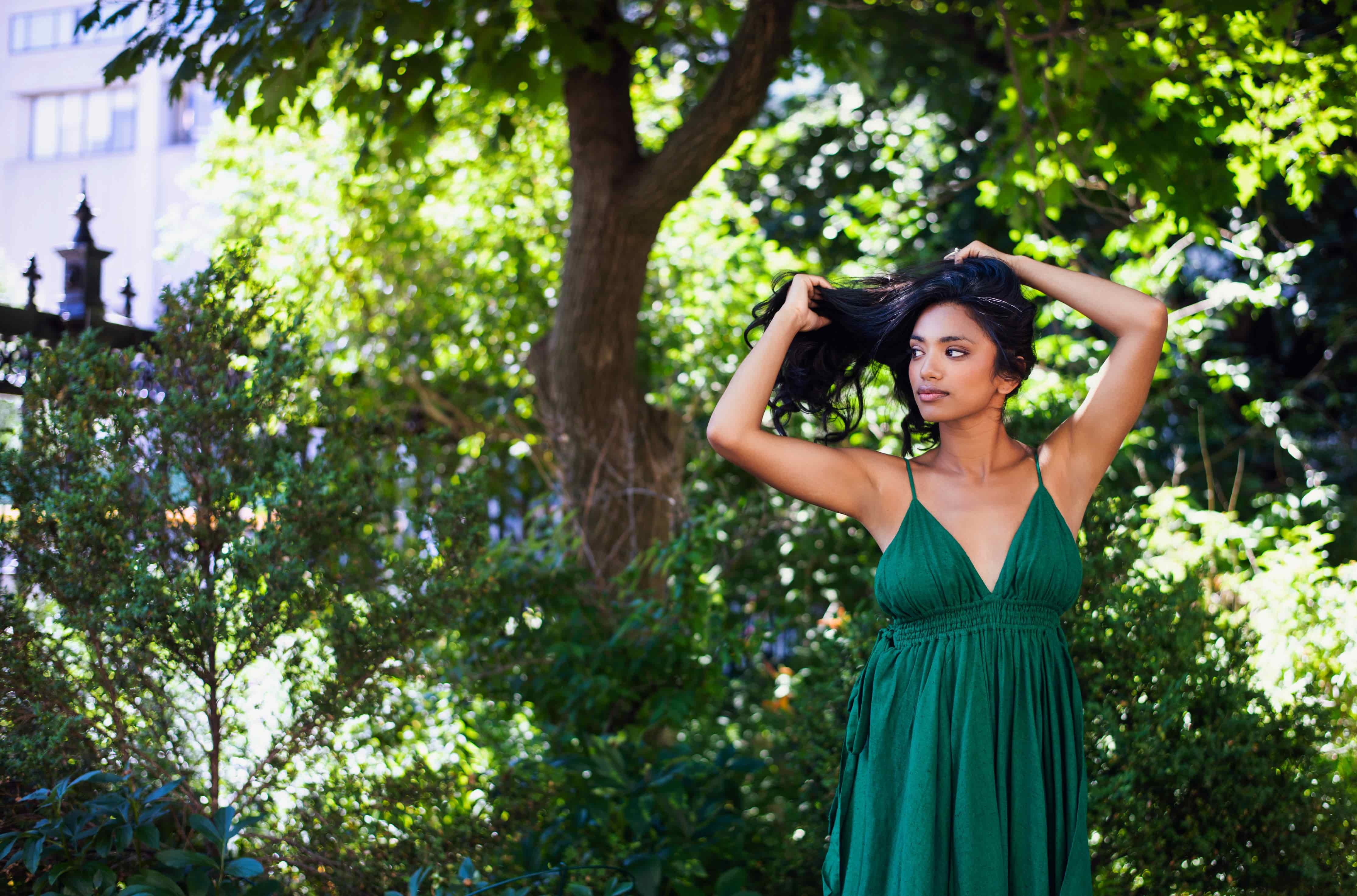 image of woman in green summer dress outside